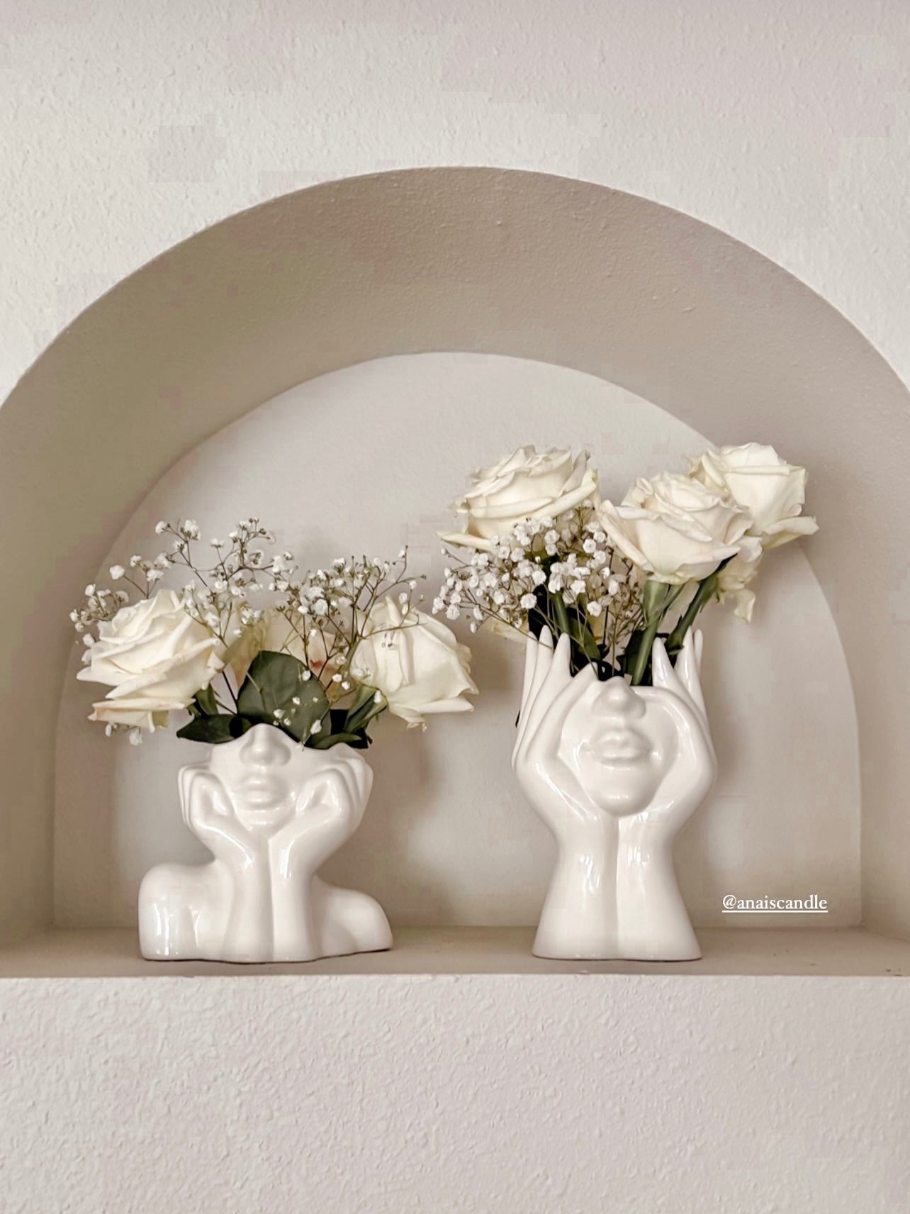 “Her” & Angelica Ceramic Vase Set of 2 decorated with white roses inside a modern arched shelf.